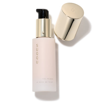 SUQQU The Primer luxury base make up product bottle on plain background with cap off.