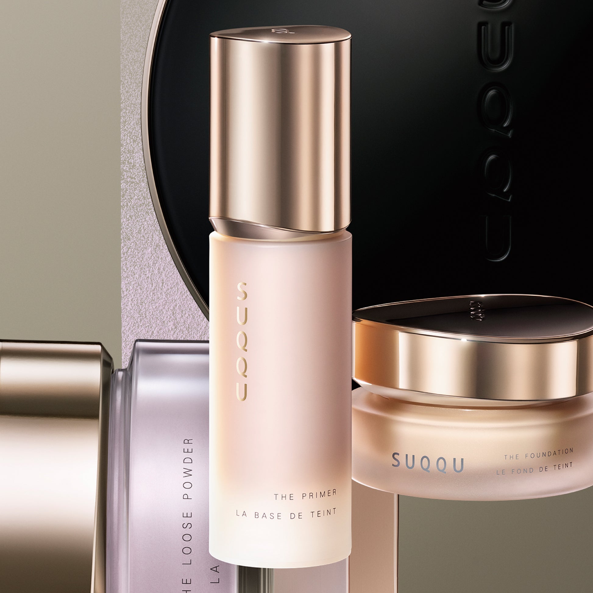 SUQQU The Primer luxury base make up product bottle with other foundation and loose powder pots.