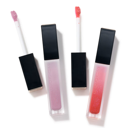 SUQQU Treatment Wrapping Lip gloss 109 sheer pink and 110 sheer red open to show applicator want and lid with case.