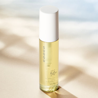 SUQQU UV Protect Mist Naginokou SPF 50 reliable Japanese premium sun care pump bottle in sunlight.