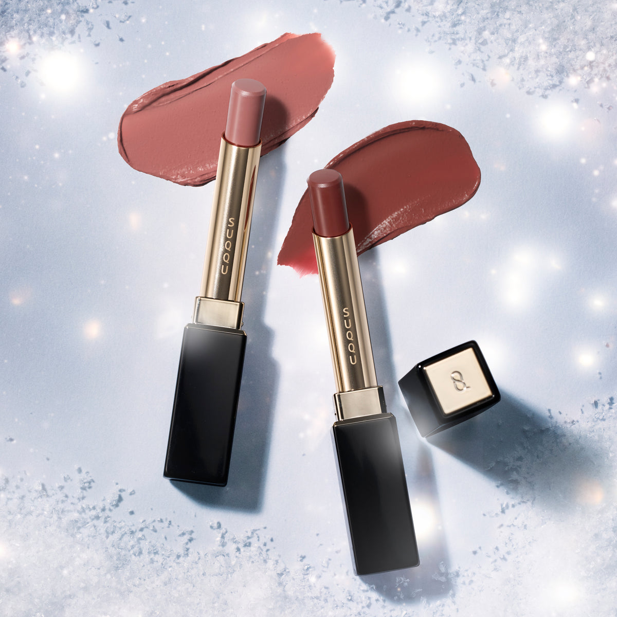 SUQQU Velvet Fit Lipstick 109 and 110 refills shown with cases and creamy texture swatches on frosty background.