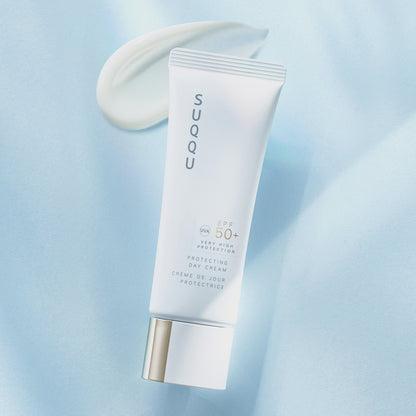 SUQQU Protecting Day Cream product video showing SPF50 skincare tube, cream texture and model application on hand. Text reads: Daily SPF50 skincare. Invisible beauty protection. Icons with text read: Anti-pollution, UVA/UVB Protection, Finest Beauty Ingredients, Long Lasting Protection, Invisible Shield, Non-sticky texture, Luxury Moisture, SPF50+ Protection.