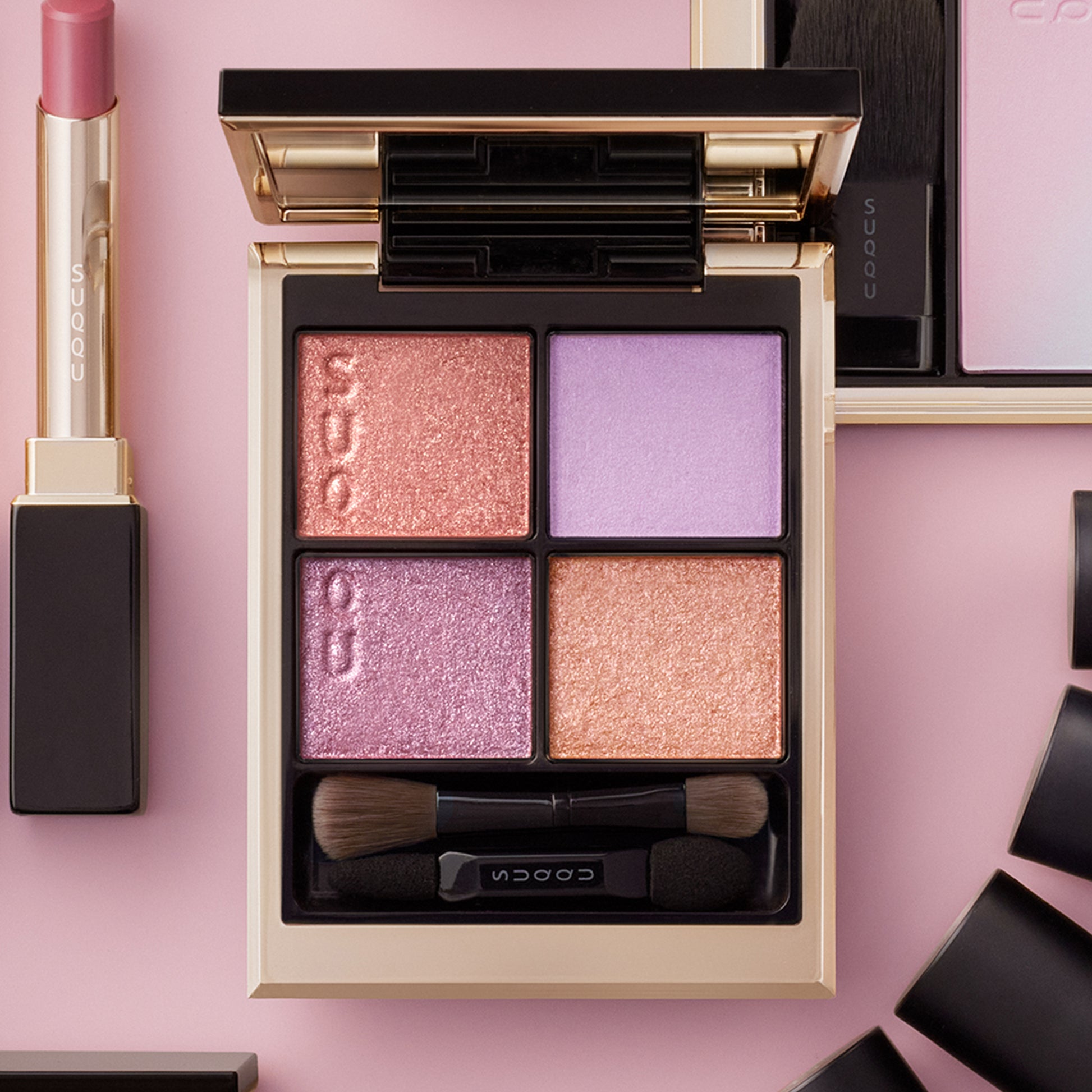 SUQQU Signature Color Eyes 151 quad colour eyeshadow palette open and surrounded by other makeup products