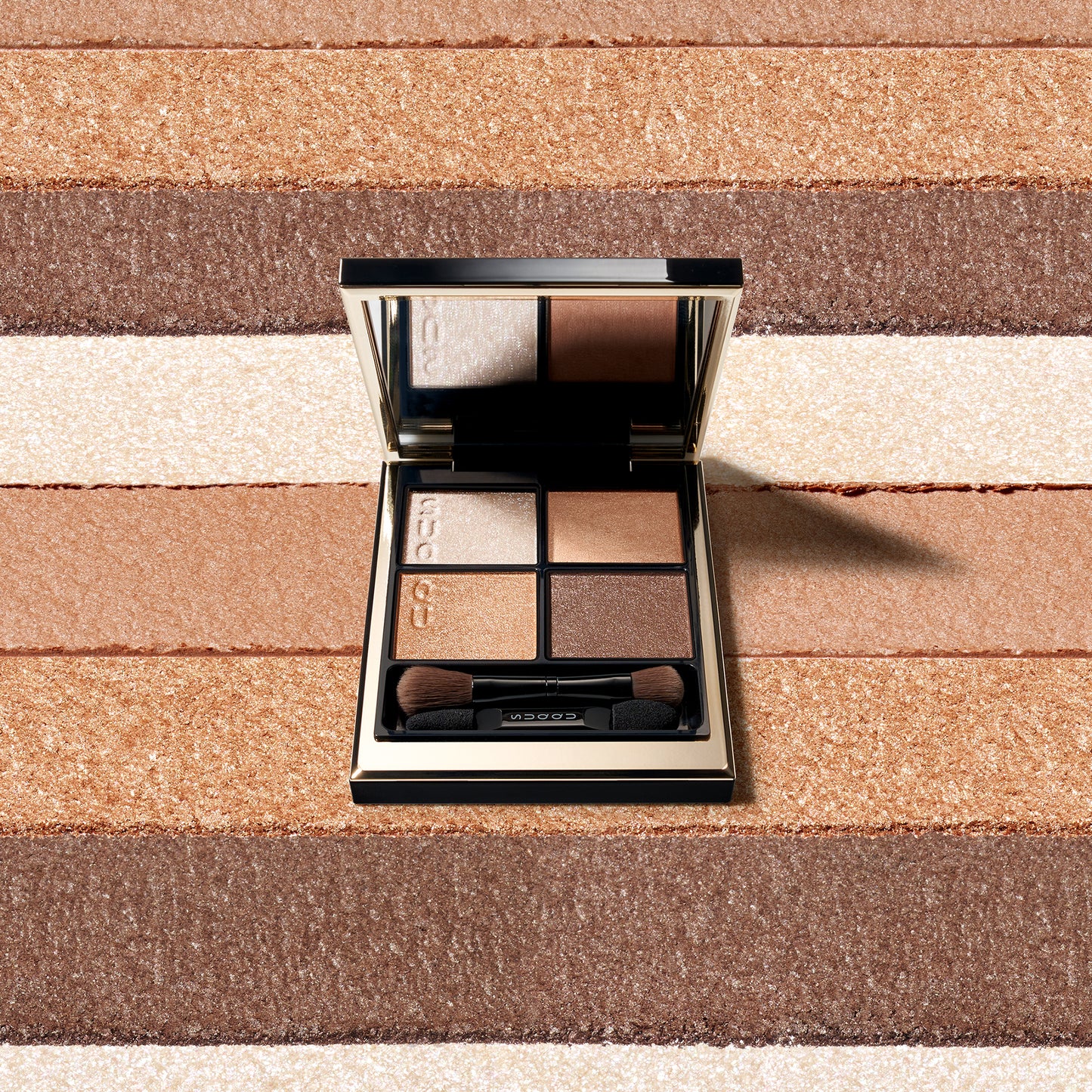 SUQQU Signature Color Eyes 15 palette with swatch colour texture background.