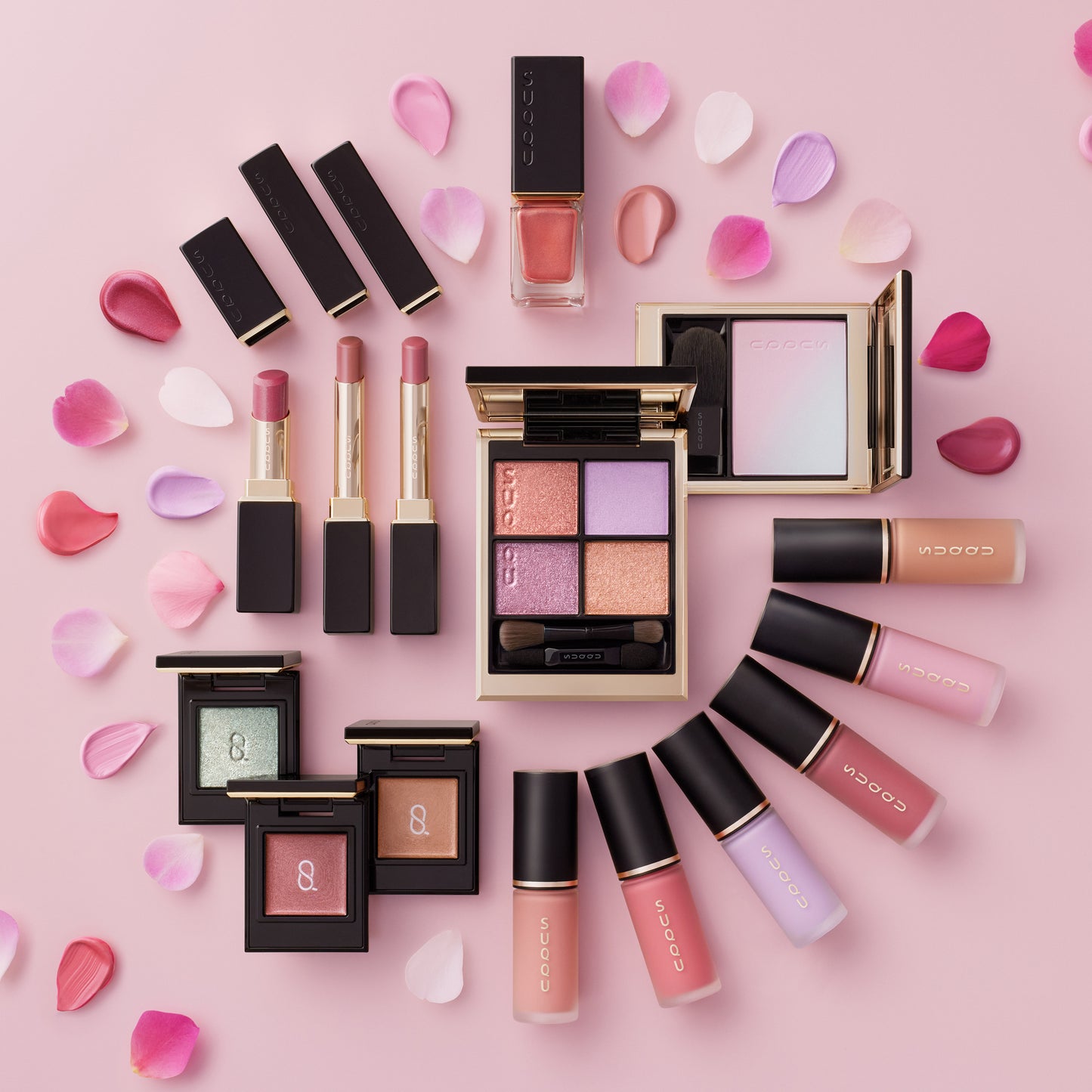 Spring color collection 2026 various colour makeup products arranged in a circle with petals.