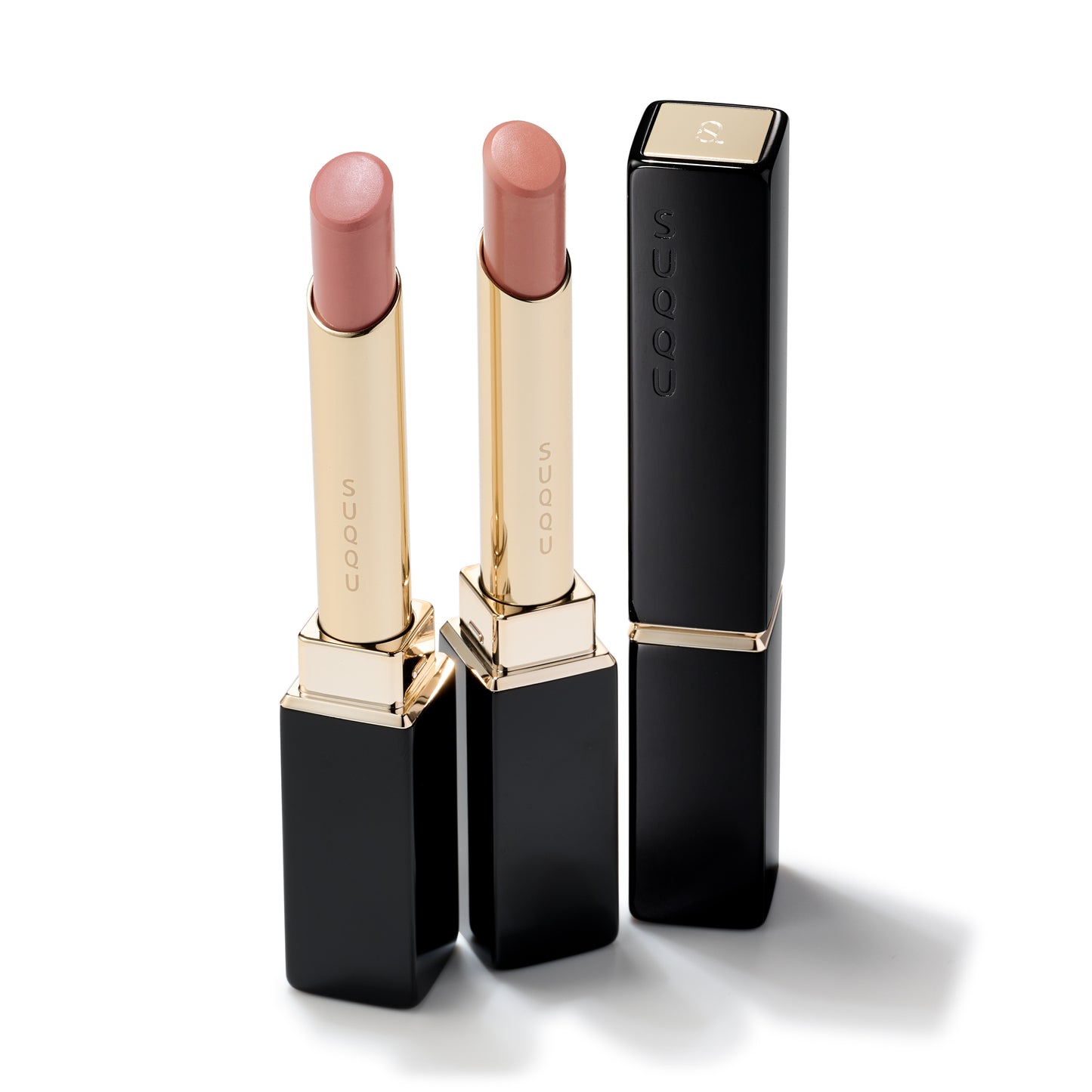 Two SUQQU Velvet Fit Lipstick refills in cases with lid off and one complete case